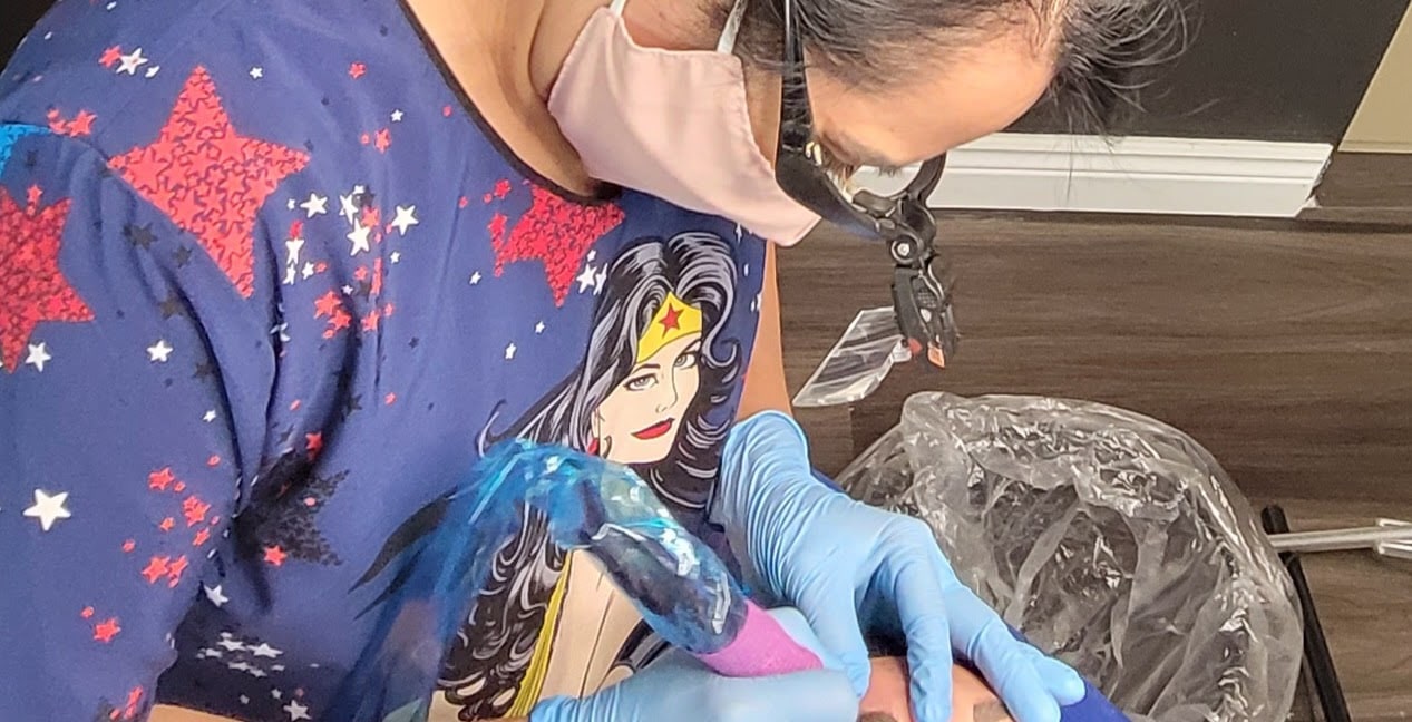 Rosario working during a permanent makeup procedure